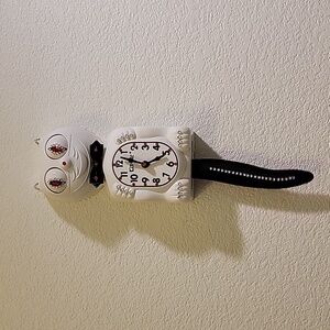 Jeweled White Kit-Cat Klock clock with black bow tie and tail